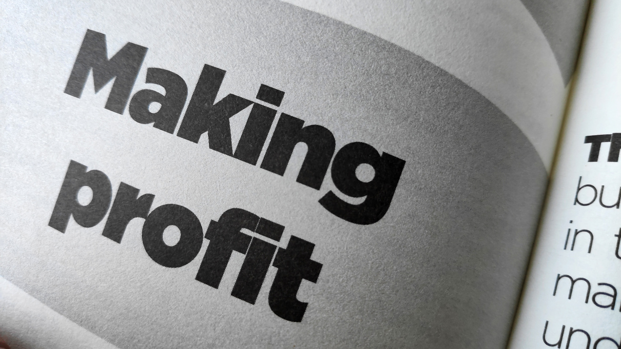 Making profit word printed on a book